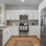 a kitchen with white cabinets