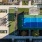 a high angle view of a courtyard with a tennis court