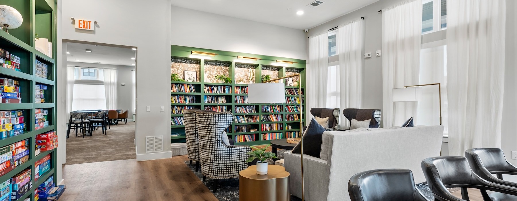 a clubroom library with chairs and books