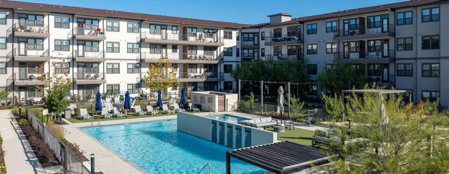 a swimming pool in front of a building