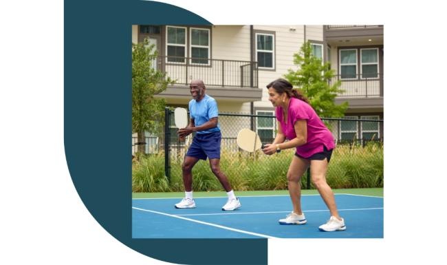 a couple of people play tennis