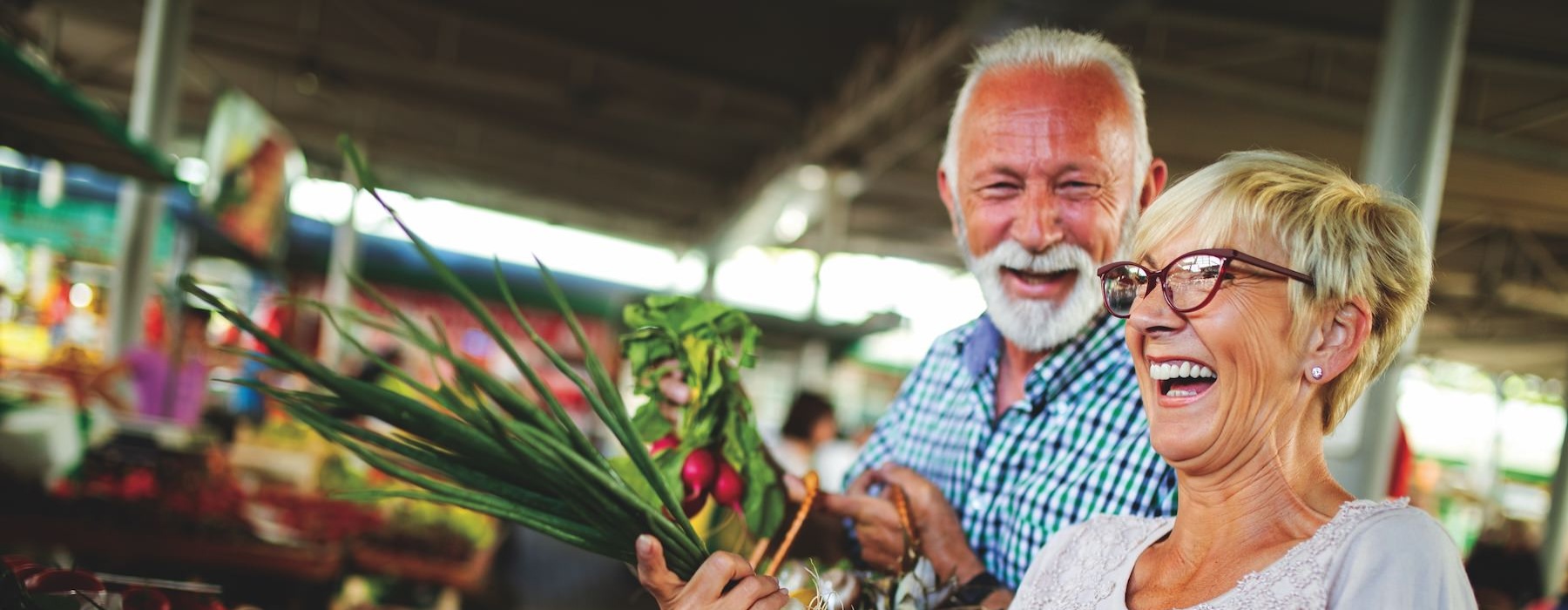 a man and woman holding flowers