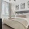 a bedroom with a bed and lamps