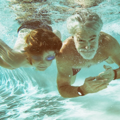 Picture of a grandfather and grandson swimming